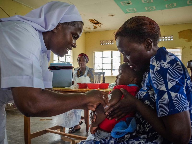 A child reacts as he receives an injection during the nationwide vaccination campaign against measles, rubella and polio targeting all children under 15 years old in Nkozi town, about 84 km from the capital Kampala, on October 19, 2019. Uganda's Ministry