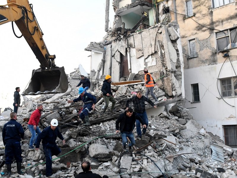 Emergency workers clear debris at a damaged building in Thumane, 34 kilometres (about 20 miles) northwest of capital Tirana, after an earthquake hit Albania, on November 26, 2019.
