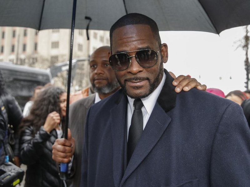 In this file photo taken on May 7, 2019 R. Kelly leaves the Leighton Criminal Court Building after a hearing on sexual abuse charges in Chicago, Illinois. R&B singer R. Kelly pleaded not guilty on December 18, 2019 to bribery charges that US media say rel