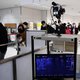 Passengers who arrived on one of the last flights from the Chinese city of Wuhan walk through a health screening station at Narita airport in Chiba prefecture, outside Tokyo, on January 23, 2020, as countries screen for anyone showing symptoms of a SARS-l