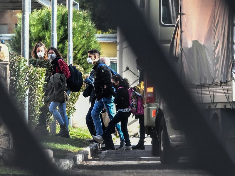 Italian citizens arrive at the Cecchignola quarantine center, south of Rome, on February 3, 2020 after being repatriated from the coronavirus hot-zone of Wuhan and landing at the nearby military airport of Pratica di Mare.