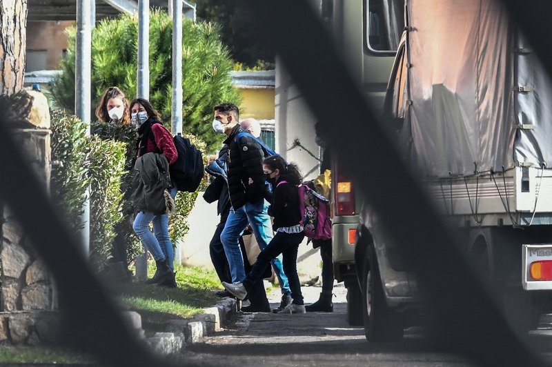 Italian citizens arrive at the Cecchignola quarantine center, south of Rome, on February 3, 2020 after being repatriated from the coronavirus hot-zone of Wuhan and landing at the nearby military airport of Pratica di Mare.