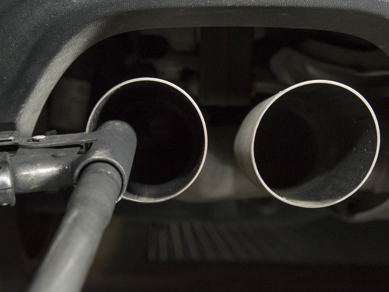 This file photo taken on August 7, 2017 shows a hose for an emission test fixed in the exhaust pipe of a Volkswagen Golf 2,0 litre diesel car at the Technical Inspection Agency in Ludwigsburg, southwestern Germany. German car giant Volkswagen said on Febr
