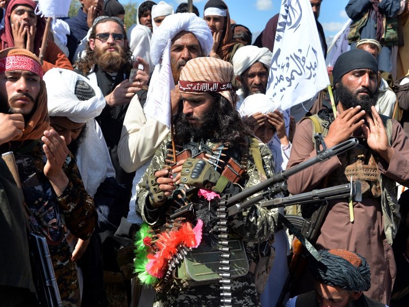 Afghan Taliban militants and villagers attend a gathering as they celebrate the peace deal and their victory in the Afghan conflict on US in Afghanistan, in Alingar district of Laghman Province on March 2, 2020. The Taliban said on March 2 they were resum