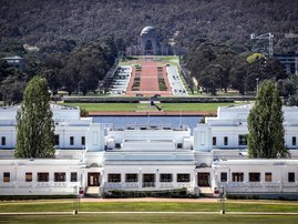 The Australian War Memorial can be seen behind the old Parliament House building in Canberra on March 22, 2020.