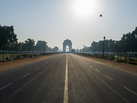 A deserted Rajpath road leading to India Gate is seen during a one-day Janata (civil) curfew imposed as a preventive measure against the COVID-19 coronavirus in New Delhi on March 22, 2020. Nearly one billion people around the world were confined to their