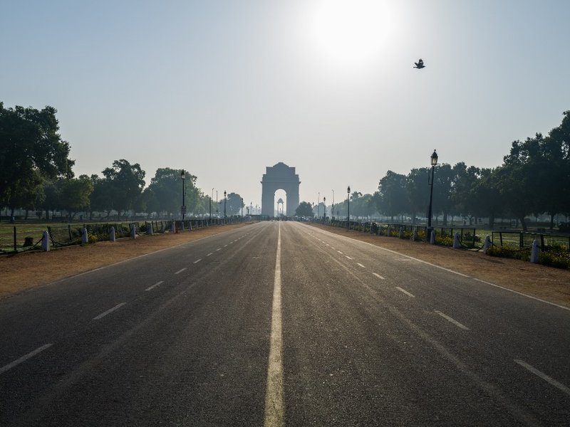A deserted Rajpath road leading to India Gate is seen during a one-day Janata (civil) curfew imposed as a preventive measure against the COVID-19 coronavirus in New Delhi on March 22, 2020. Nearly one billion people around the world were confined to their