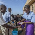 Parishoners wash hands as a preventive measure against the spred of the COVID-19 coronavirus on the last day of full gatherings as a parish at the Saint Don Bosco Catholic Parish in Lilongwe on March 22, 2020. Malawian President Arthur Peter Mutharika, wh