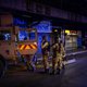 Members of the South African National Defence Force (SANDF) climb on an Armoured Personal Carrier (APC) during an operation in the Johannesburg CBD, on March 27, 2020. South Africa came under a nationwide military-patrolled lockdown on March 27, 2020, joi