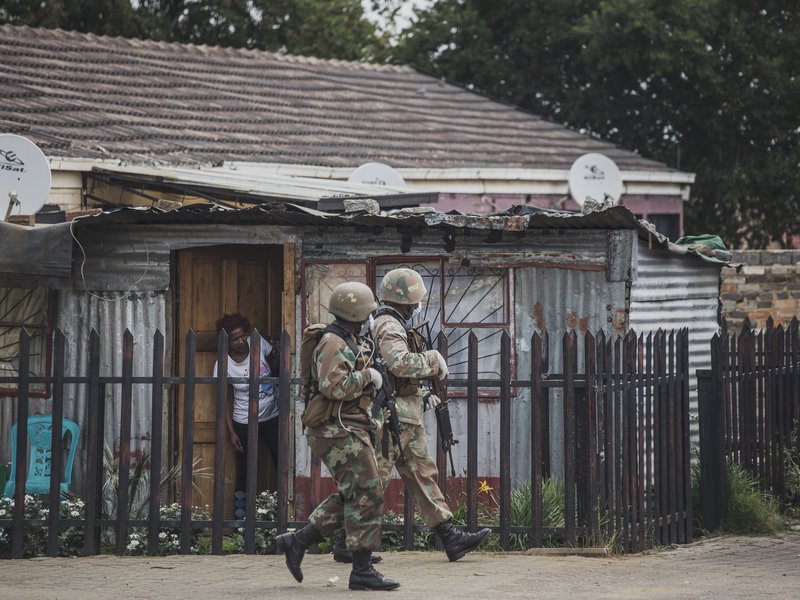 A South African National Defence Force (SANDF) patrol is seen in Eldorado Park on March 30, 2020. South Africa came under a nationwide lockdown on March 27, 2020, joining other African countries imposing strict curfews and shutdowns in an attempt to halt