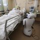 One of the six robots of the Circolo di Varese hospital stands near a patient, on April 3, 2020, to help the healthcare staff of the High Intensity Medicine department to assist twelve patients suffuring from the epedemic Covid-19, caused by the novel cor