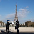 A French police officer control the outings authorisation of a person near Champs de Mars in Paris, on April 6, 2020, on the twenty-first day of a strict lockdown in France to stop the spread of COVID-19, caused by the novel coronavirus.