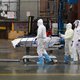 Medical personnel move a deceased patient to a refrigerated truck serving as make shift morgues at Brooklyn Hospital Center on April 09, 2020 in New York City. America's coronavirus epicenter of New York recorded a new single-day high of 799 COVID-19 deat