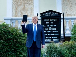 US President Donald Trump holds a Bible while visiting St. John's Church across from the White House after the area was cleared of people protesting the death of George Floyd June 1, 2020, in Washington, DC. US President Donald Trump was due to make a tel