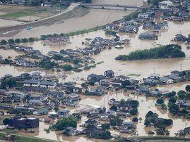 This picture shows inundated houses due to heavy rain in Hitoyoshi, Kumamoto prefecture on July 4, 2020. Fourteen people were feared dead at a nursing home in western Japan on July 4 as record rainfall triggered massive floods and landslides, forcing auth
