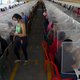 Workers have lunch separated by plastic panels as a preventive measure against the spread of the novel coronavirus COVID-19, at the textile plant K.P.Textil in San Miguel Petapa, 20 km south of Guatemala City, on July 10, 2020. Employees of the textile pl