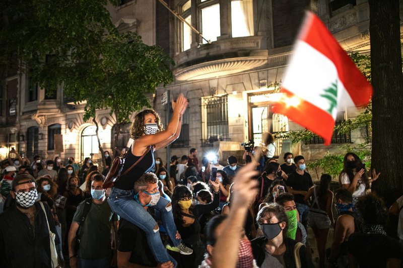 Protesters shout slogans against Lebanon's government as they rally in front of the Lebanese consulate on August 6, 2020, in New York. Shock has turned to anger in a traumatised nation where at least 149 people died and more than 5,000 were injured in Tue