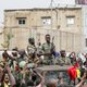 Armed members of the FAMA (Malian Armed Forces) are celebrated by the population as they parade at Independence Square in Bamako on August 18, 2020, after rebel troops seized Malian President Ibrahim Boubacar Keita and Prime Minister Boubou Cisse in a dra