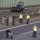 Police investigators fly a drone at the site where a motorcycle crashed with a car, probably the car used by an alleged offender to cause several accidents on the A 100 highway in Berlin on August 19, 2020. A man caused a series of motorway accidents in B