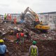 Rescue workers search for people in the rubble of a collapsed five-storey apartment building in Mahad on August 25, 2020. One person was killed and dozens feared trapped after a five-storey apartment building collapsed late August 24 in western India, off