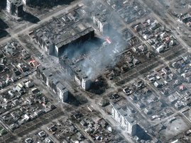 This Maxar satellite image taken and released on March 22, 2022 shows burning and destroyed high-rise apartment buildings in Mariupol, Ukraine. Thousands of Ukrainians sought to escape the hellish siege of Mariupol on March 22, as Russia pounded the city