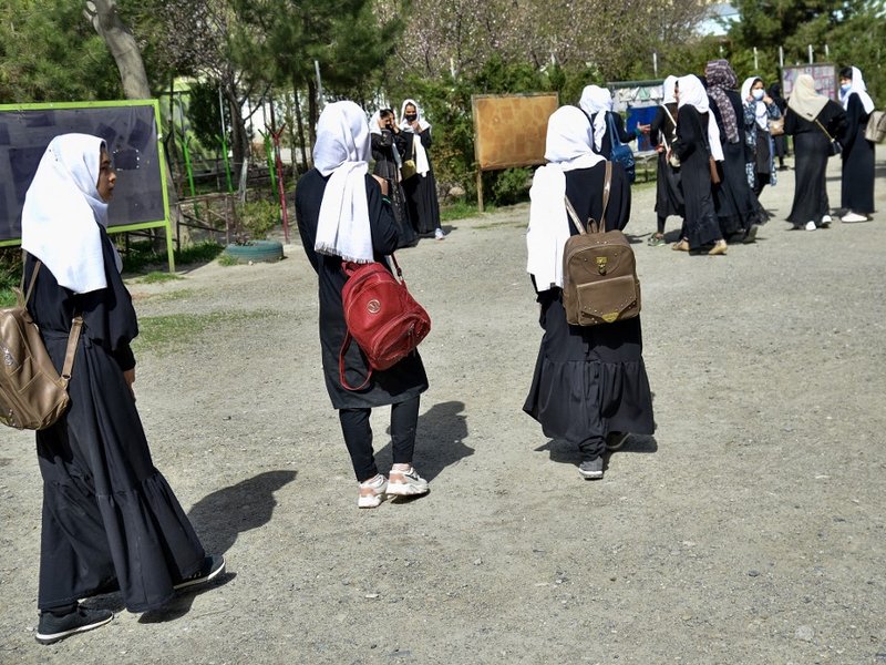 Girls leave their school following order of closure just hours after reopening in Kabul on March 23, 2022. The Taliban ordered girls' secondary schools in Afghanistan to shut on March 23 just hours after they reopened, an official confirmed, sparking conf