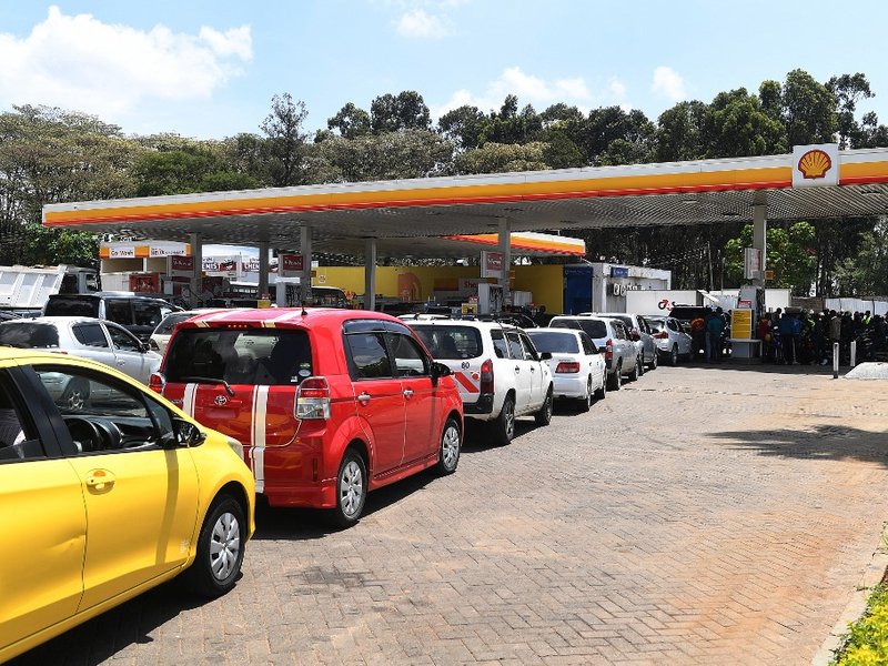 Motorists queue for fuel at a Shell petrol station in Nairobi on April 4, 2022. Kenyan motorists endured another day of major fuel shortages on April 4, 2022 with hours-long queues and strict rationing at petrol stations as pumps across the country ran dr