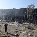 A man takes pictures of the shopping and entertainment center in the Ukrainian Black Sea city of Odessa on May 10, 2022, destroyed after Russian missiles strike late on May 9, 2022.