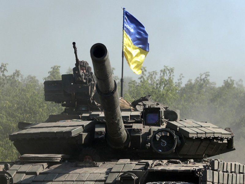 Ukrainian troop ride a tank on a road of the eastern Ukrainian region of Donbas on June 21, 2022, as Ukraine says Russian shelling has caused "catastrophic destruction" in the eastern industrial city of Lysychansk, which lies just across a river from