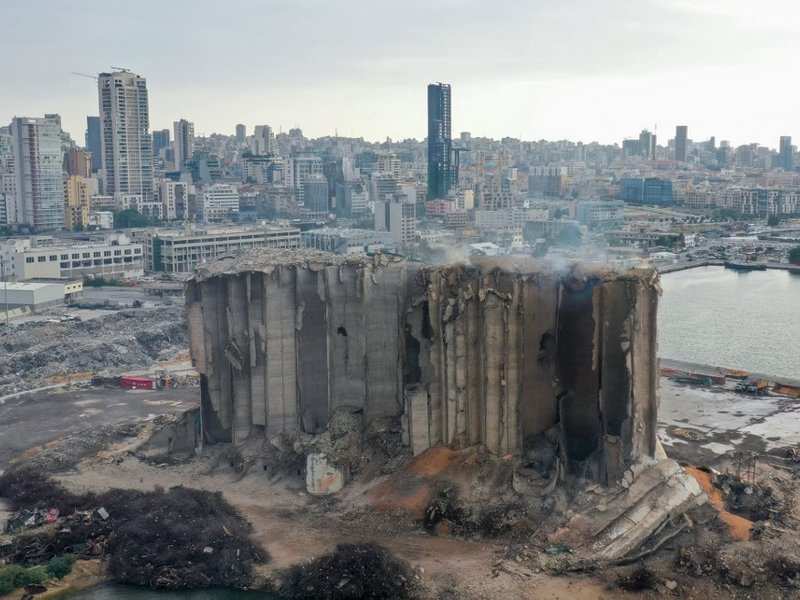 An aerial picture shows a view of the heavily damaged grain silos at the port of the Lebanese capital Beirut, on July 31, 2022, following a partial collapse due to an ongoing fire since the beginning of the month.