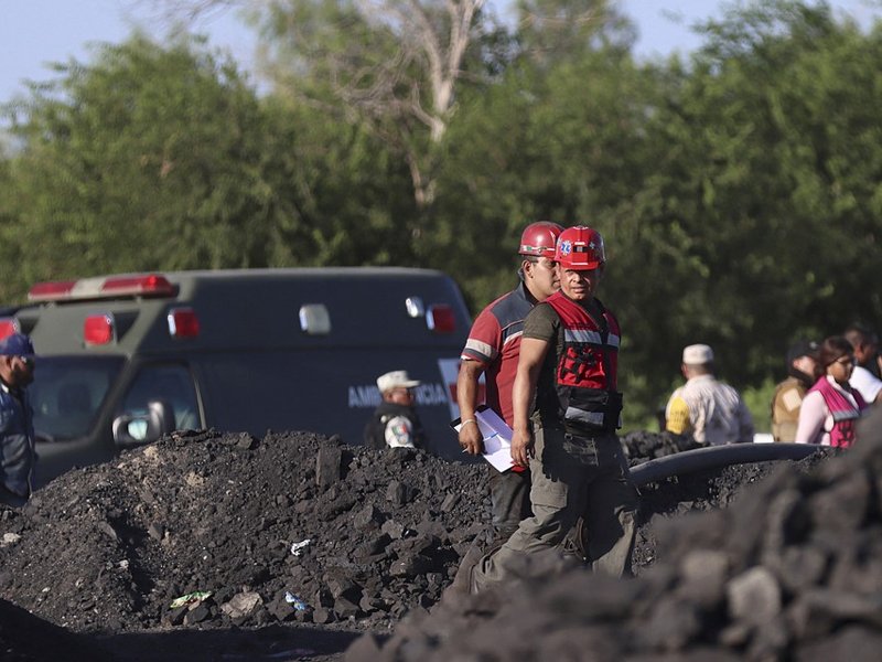 Rescue personnel work in the area of an accident at a coal mine, following a collapse which left -up to now- nine miners trapped, in the Agujita area, Sabinas municipality, Coahuila state, Mexico, on August 3, 2022.