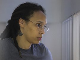 US' Women's National Basketball Association (WNBA) basketball player Brittney Griner, who was detained at Moscow's Sheremetyevo airport and later charged with illegal possession of cannabis, waits for the verdict inside a defendants' cage during a hearing