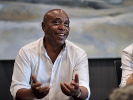 Tokyo Sexwale (L), South African businessman and former politician, and Gianni Infantino, general secretary of the European soccer federation UEFA, both candidates for the presidency of world football's governing body FIFA, address the media in Cape Town