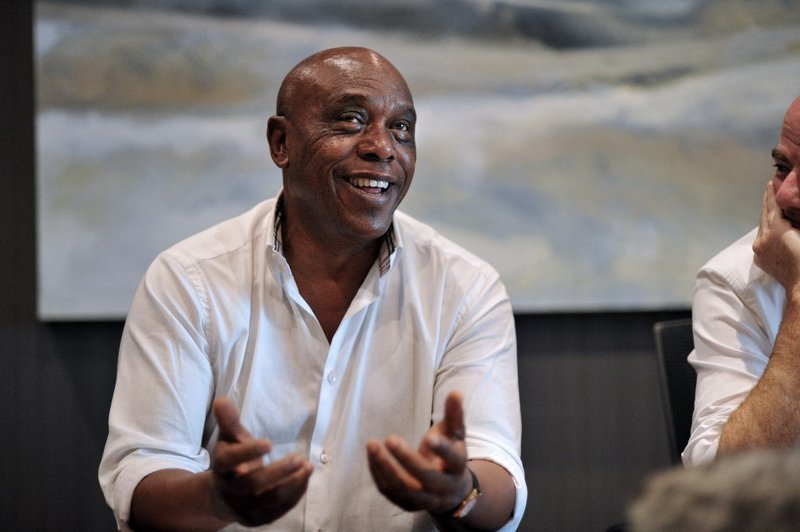 Tokyo Sexwale (L), South African businessman and former politician, and Gianni Infantino, general secretary of the European soccer federation UEFA, both candidates for the presidency of world football's governing body FIFA, address the media in Cape Town