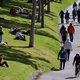 People exercise at a park along the Yarra River in Melbourne on September 27, 2020 as an overnight curfew in Australia's second-biggest city will be lifted from September 28, almost two months after it was imposed to counter a surging COVID-19 coronavirus