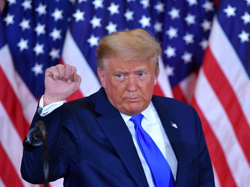 US President Donald Trump pumps his fist after speaking during election night in the East Room of the White House in Washington, DC, early on November 4, 2020.