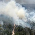 This handout picture taken on November 29, 2020 and released by the Queensland Fire and Emergency Services shows an aerial view of bushfires on Fraser Island, off Australia's east coast.