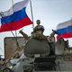 Russian troops are pictured in a joint convoy with Turkish troops (unseen) patrolling in oil fields near the town of al-Qahtaniyah, in Syria's northeastern Hasakeh province close to the Turkish border, on February 4, 2021.