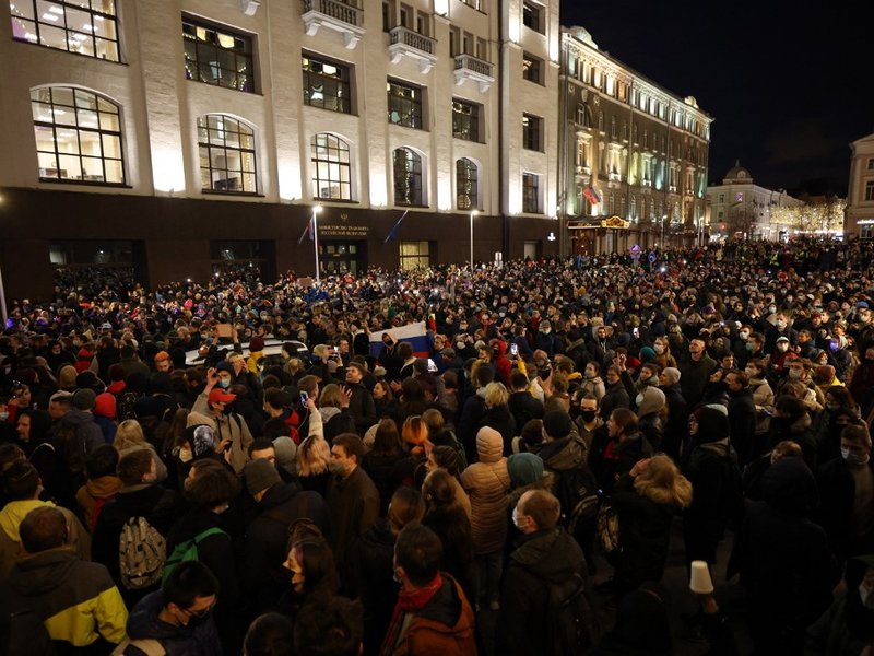 Opposition supporters hold their cell phones during a rally in support of jailed Kremlin critic Alexei Navalny, in central Moscow on April 21, 2021. Jailed Kremlin critic Alexei Navalny's team called for demonstrations in more than 100 cities, after the o