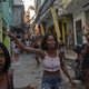 Residentes protest after a police operation against alleged drug traffickers at the Jacarezinho favela in Rio de Janeiro, Brazil, on May 06, 2021. A massive police operation against drug traffickers in a Brazilian favela Thursday left 25 people dead, turn