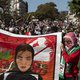 Demonstrators hold banners and wave Palestinian flags as they march through the city centre of Cape Town, South Africa, on May 11, 2021 to protest against Israeli attacks on Palestinians in Gaza as violence escalated between the bitter rivals sparked by u