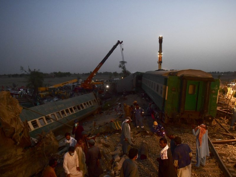 Railway workers operate at the site of a train accident in Daharki area of the northern Sindh province on June 7, 2021, as at least 43 people were killed and dozens injured when a packed Pakistani inter-city train ploughed into another express that had de