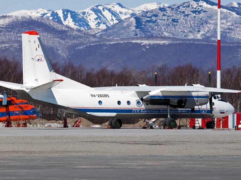 This handout photograph released by the Russian Emergency Situations Ministry on July 6, 2021, shows Russian An-26 aircraft with the tail number RA-26085 on the apron at the airport of Patropavlovsk-Kamchatckiy. Contact has been lost with a passenger plan
