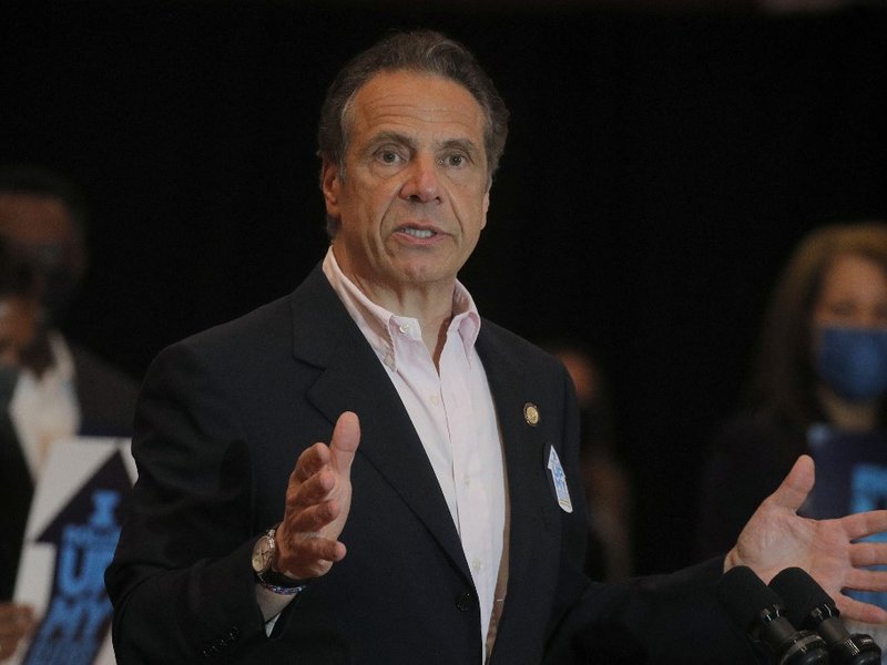 (FILES) In this file photo taken on April 5, 2021 New York Governor Andrew Cuomo speaks at Rochdale Village Community Center in Queens, New York. New York's governor issued new emergency measures to fight gun violence Tuesday, as he made it easier for sho