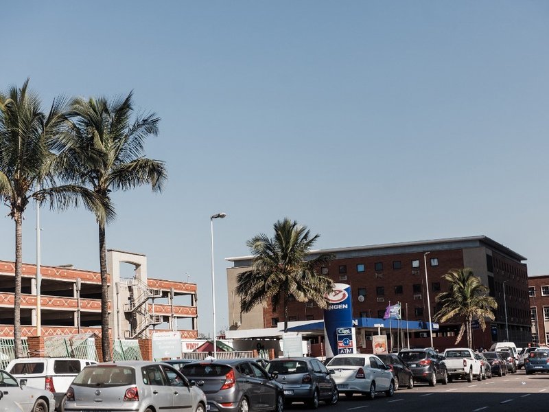 Hundreds of cars queue to fill petrol at a local feul station in central Durban stoking a fear of fuel shortages in Durban on July 14, 2021 as several shops, businesses and infrastructure are damaged in the city, following five nights of continued violenc