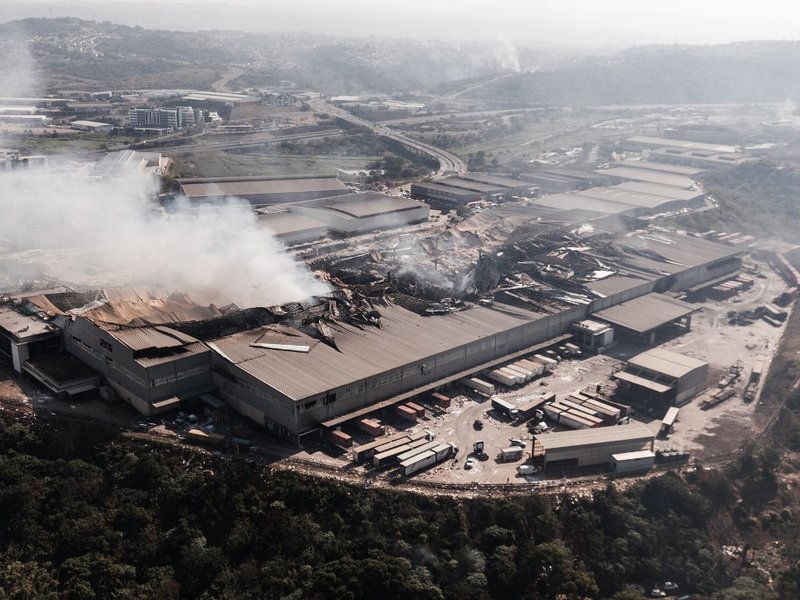 This aerial view taken on July 15, 2021, shows fire gutted at the Game store in Queen Nandi Drive in Durban. The businesses were hit by looters on July 13, despite the troops President Cyril Ramaphosa deployed to try to quell unrest. As pillaging erupted