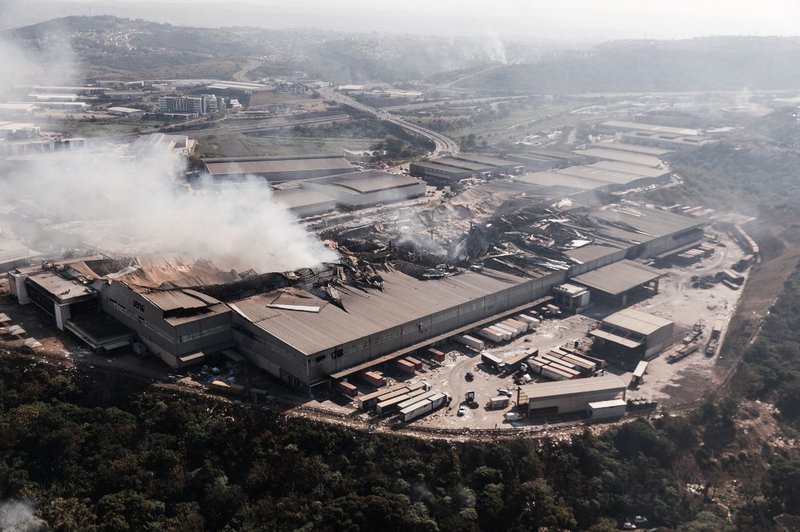 This aerial view taken on July 15, 2021, shows fire gutted at the Game store in Queen Nandi Drive in Durban. The businesses were hit by looters on July 13, despite the troops President Cyril Ramaphosa deployed to try to quell unrest. As pillaging erupted