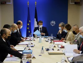 French President Emmanuel Macron (C) flanked by French Prime Minister Jean Castex (4L), French European and Foreign Affairs Minister Jean-Yves Le Drian (3L), French Interior Minister Gerald Darmanin (2L), Secretary General of the Elysee Palace Alexis Kohl