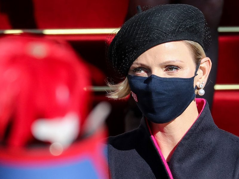 ) In this file photo taken on November 19, 2020 Princess Charlene of Monaco, wearing a face mask, leaves after attending a mass during the celebrations marking Monaco's National Day at the Cathedral of Monaco in Monaco Princess Charlene of Monaco will und