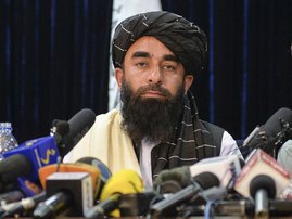 Taliban spokesperson Zabihullah Mujahid looks on as he addresses the first press conference in Kabul on August 17, 2021 following the Taliban stunning takeover of Afghanistan